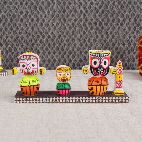 Colorful Lord Jagannath idol in vibrant traditional attire, perfect for car dashboard or home altar, symbolizing protection, devotion, and travel blessings. Indiaβs Largest Pooja Accessories Brand - www.satvikstore.in