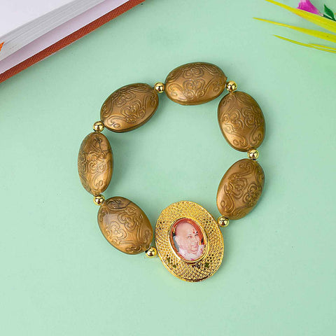 Guruji Swaroop Bracelet with chunky oval beads in golden, blue, purple, and pink β perfect for spiritual wear or gifting. Indiaβs Largest Pooja Accessories Brand β www.satvikstore.in