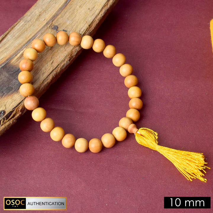 Handcrafted 10mm 27 Bead White Chandan Money Mala made from pure sandalwood beads for meditation, mantra chanting, and attracting wealth and positive energy.India’s Premium Jap Mala Store - www.satvikstore.in