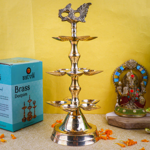 Brass 3 Step Panchmukhi Peacock Kerala Diya β Handcrafted brass diya with a three-step structure, Panchmukhi (five-faced) design, and peacock motif, perfect for pooja rituals, temple lighting, and traditional dΓ©cor. Indiaβs Largest Pooja Accessories Brand β www.satvikstore.in