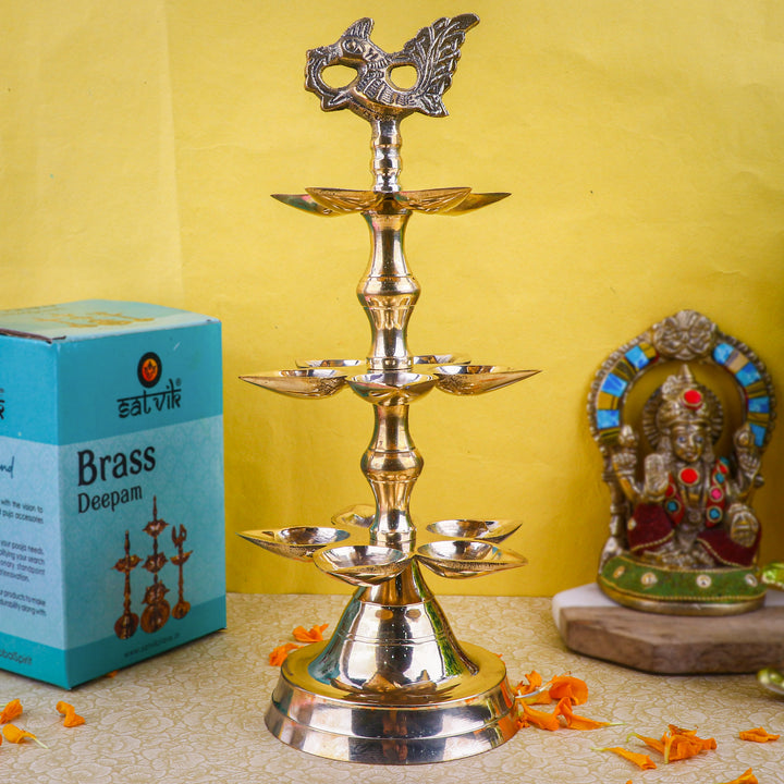 Brass 3 Step Panchmukhi Peacock Kerala Diya β Handcrafted brass diya with a three-step structure, Panchmukhi (five-faced) design, and peacock motif, perfect for pooja rituals, temple lighting, and traditional dΓ©cor. Indiaβs Largest Pooja Accessories Brand β www.satvikstore.in