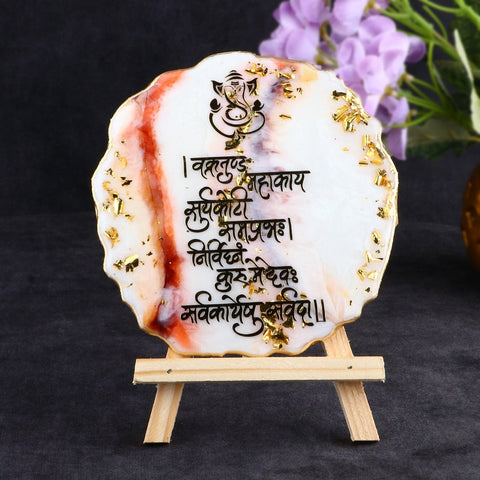 Decorative Ganesha Mantra frame with a built-in stand, crafted in epoxy resin, featuring a divine depiction of Lord Ganesha and sacred mantra inscriptions. Indiaβs Largest Pooja Accessories Brand β www.satvikstore.in