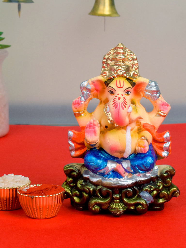 4-inch colorful eco-friendly Ganesha idol with golden mukut, made of natural clay and hand-painted in vibrant hues, ideal for home puja and visarjan. India’s Largest Pooja Accessories Brand – www.satvikstore.in