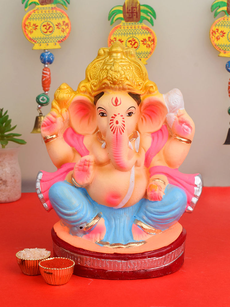 8-inch eco-friendly Ganesha idol made of natural clay, hand-painted in vibrant colors, ideal for sustainable Ganesh Chaturthi celebrations India’s Largest Pooja Accessories Brand – www.satvikstore.in