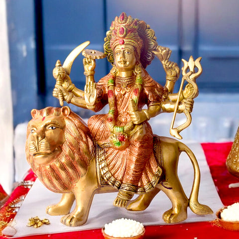 11 Inch Brass Idol of Sherawali Mata Statue for Home Temple Elevate your home temple with this Brass Sherawali Mata Idol, a beautifully crafted depiction of Durga Maa on her lion. Made from premium brass with intricate detailing, this durable statue is perfect for Pooja, festive décor, or gifting. India's Largest Puja Accessories Brand - Satvik