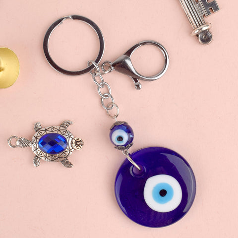 Metal Blue Evil Eye Keychain – A stylish, protective charm for keys, bags, or as a perfect gift. India’s Largest Pooja Accessories Brand – www.satvikstore.in