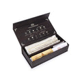 A box of Mysuru to the World incense with a variety of incense sticks and an elephant-shaped ash catcher, all displayed in an elegant black packaging with gold accents.