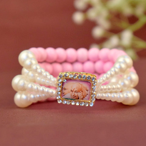 Pink & White Pearl Four Layer Guruji Swaroop Bracelet featuring delicate pink beads and luminous white pearls with Jai Guruji Swaroop – perfect for spiritual wear, festive gifting, and daily devotion. India’s Largest Pooja Accessories Brand – www.satvikstore.in