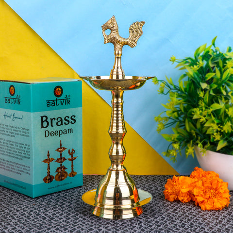 9.5 Inch Brass Peacock Kerala Diya – Handcrafted brass diya featuring a peacock motif, ideal for pooja rituals, temple lighting, and traditional décor. India’s Largest Pooja Accessories Brand – www.satvikstore.in